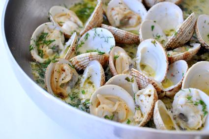 Cooking clams in a pan