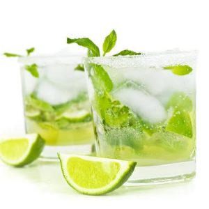 Cold mojito drink, glass of alcohol isolated over white background, fresh mint and lime fruit slice, food still life, party and holidays celebration